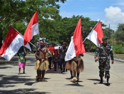 Wujudkan Papua, Damai, Tentram, dan Cinta Tanah Air, Satgas Yonif 122/TS Gelar Pengibaran Bendera Merah Putih Sepanjang 1 KM di Perbatasan Skouw RI-PNG